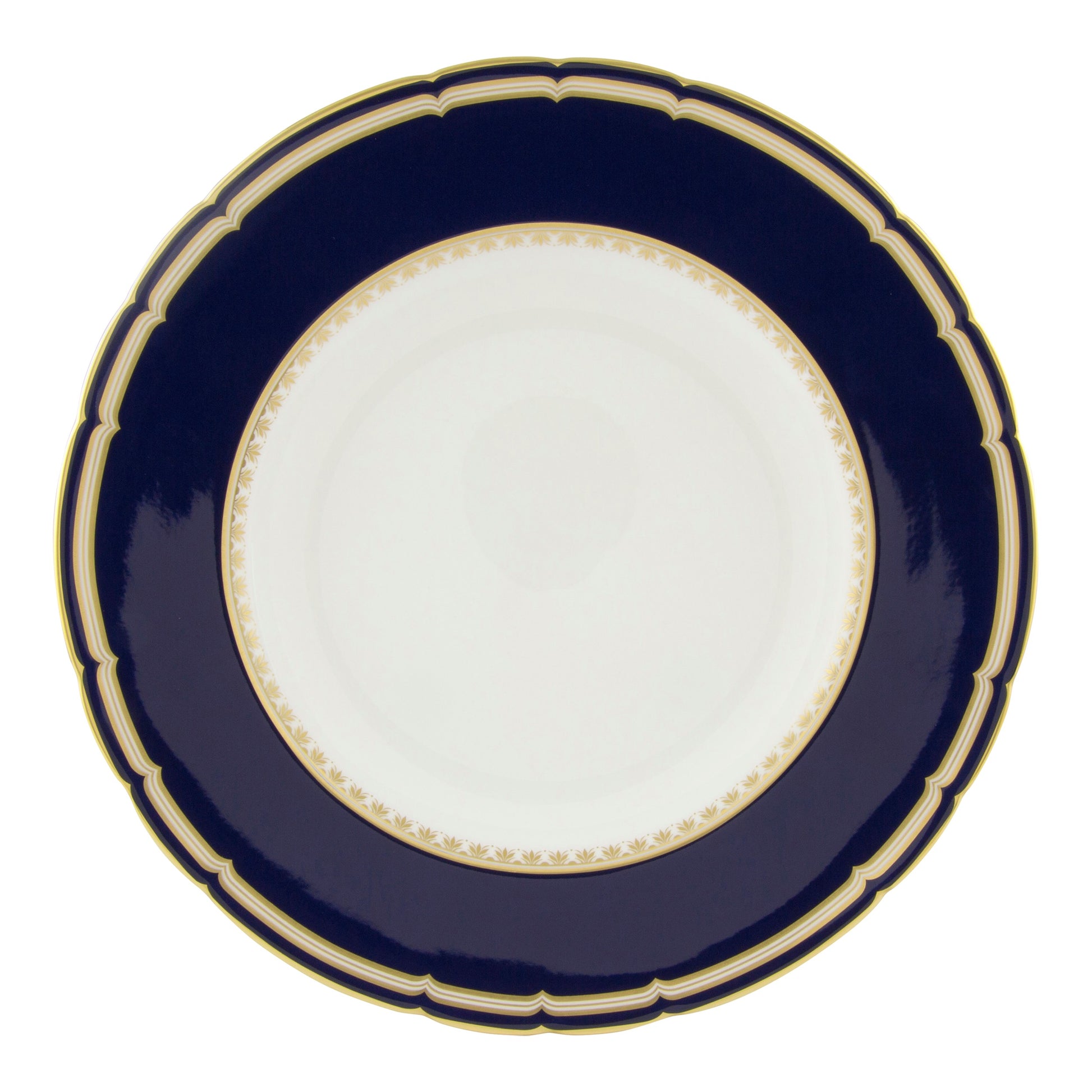 The Ashbourne Navy Dinnerware Collection by Royal Crown Derby features round porcelain plates with a wide dark blue border, gold trim, and a white center, showcasing British craftsmanship.