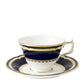 The Ashbourne Navy Dinnerware Collection by Royal Crown Derby features a fine bone china teacup and saucer adorned with navy blue and gold accents, highlighting exquisite British craftsmanship.