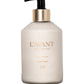 A 10.5 fl oz (295 ml) pump bottle of L'Avant Collective Ambre Santal Collection hand lotion, featuring a luxurious scent blend inspired by perfume and sandalwood.