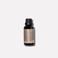 A small amber glass bottle of Ambre Santal Collection sandalwood fragrance oil, featuring a black cap and a neutral-toned label.