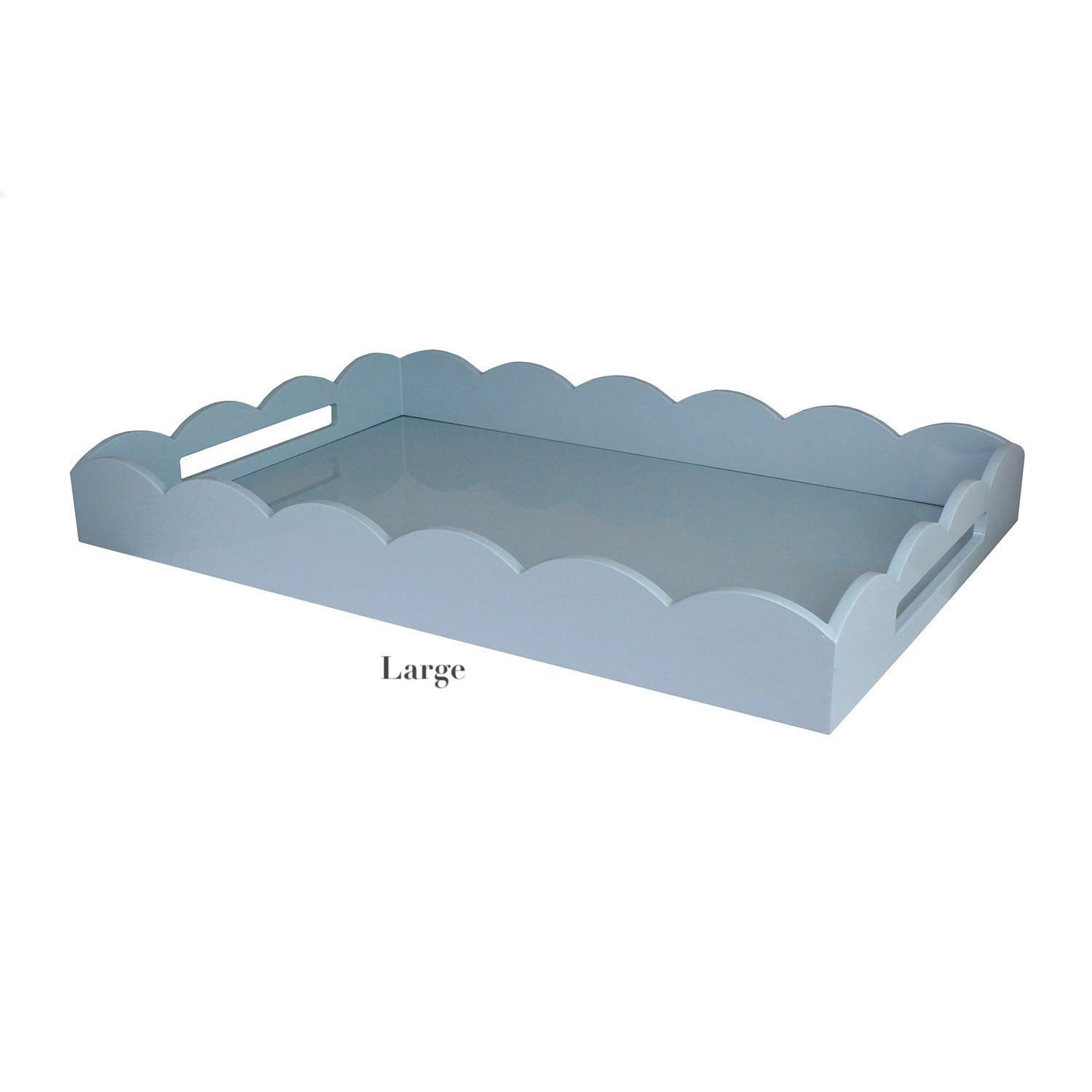 The Scalloped Pale Denim Lacquer Tray Collection by Addison Ross features large rectangular trays with scalloped edges, side handles, a glossy pale denim finish, and the signature Addison Ross logo.
