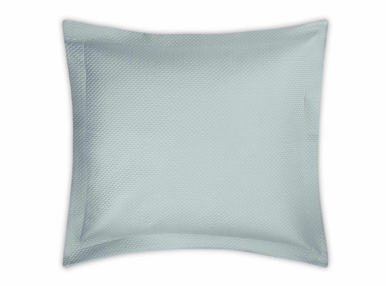 A light blue textured rectangular pillow with a subtle diamond pattern from the Alba Bedding Collection, Pool by Matouk, designed to complement Nocturne sateen bedding, shown against a white background.