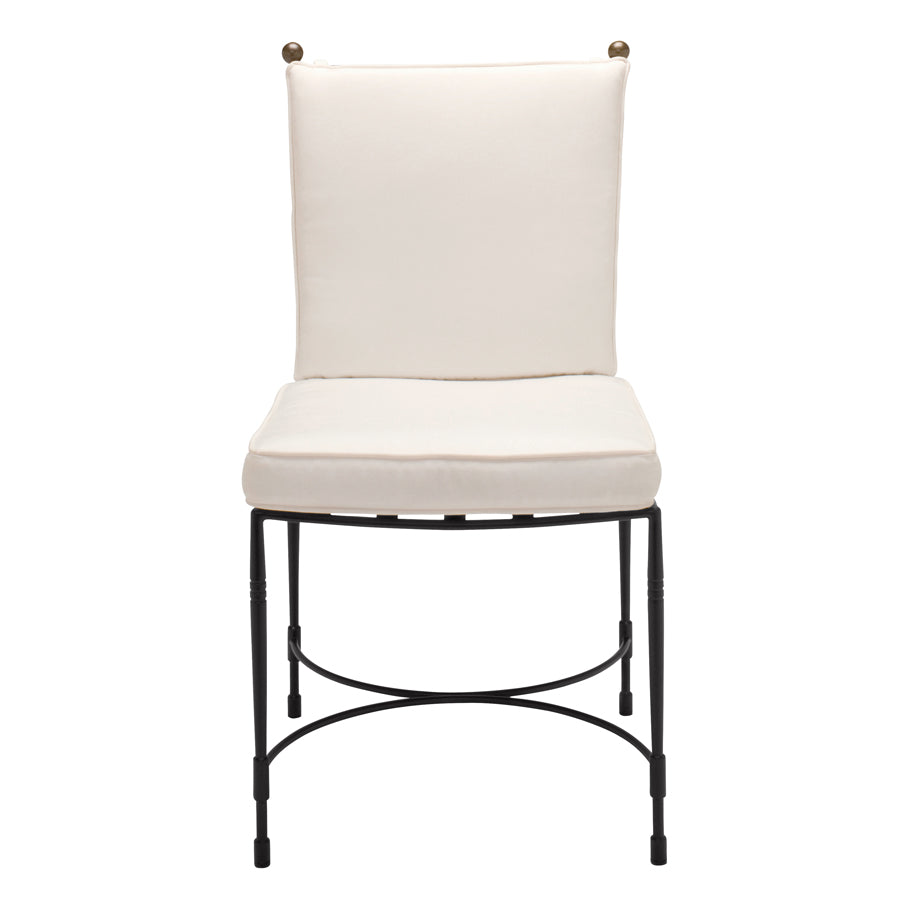 The Amalfi Dining Side Chair in Slate by Janus et Cie features a white cushion, black metal frame, and curved stretcher at the base, inspired by sleek Amalfi outdoor furniture design and viewed from the front.