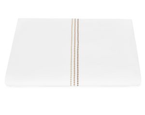 The Matouk Amara Pearl Bedding Collection in Beach features an elegant white rectangular design with three vertical gold dotted lines embroidered near the center, shown on a white background.