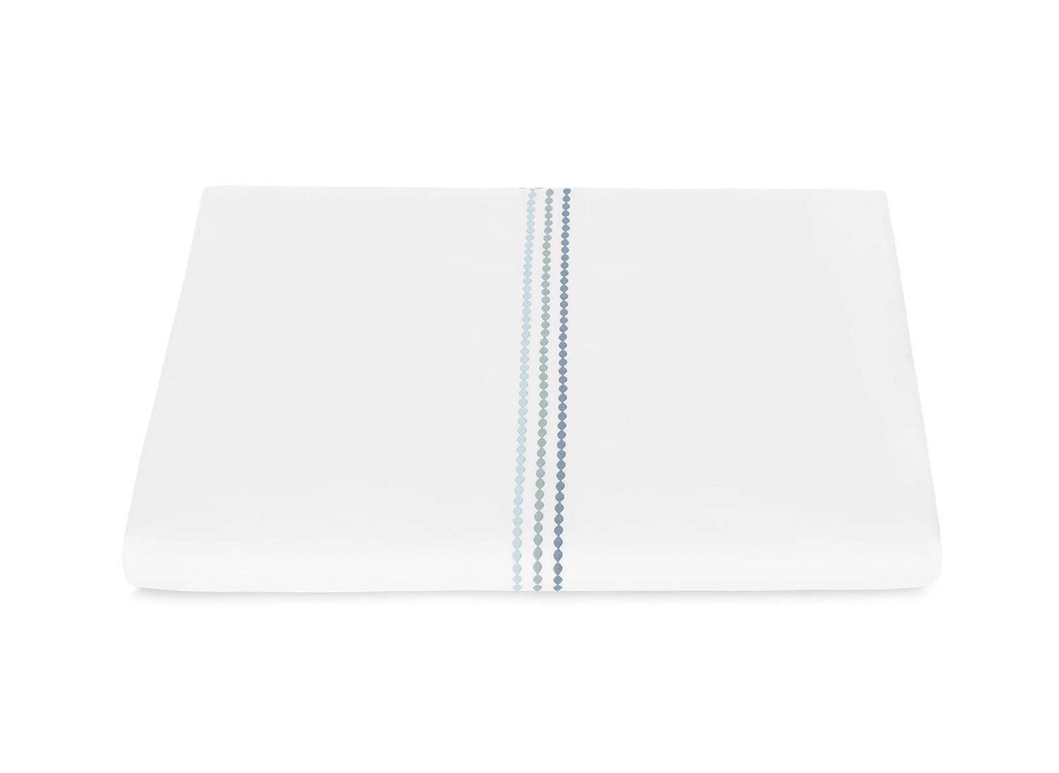 Displayed against a white background, the Matouk Amara Triple Pearl Bedding Collection features folded white sateen sheets accented with three parallel rows of blue embroidered pearls near the edge for an elegant, refined look.