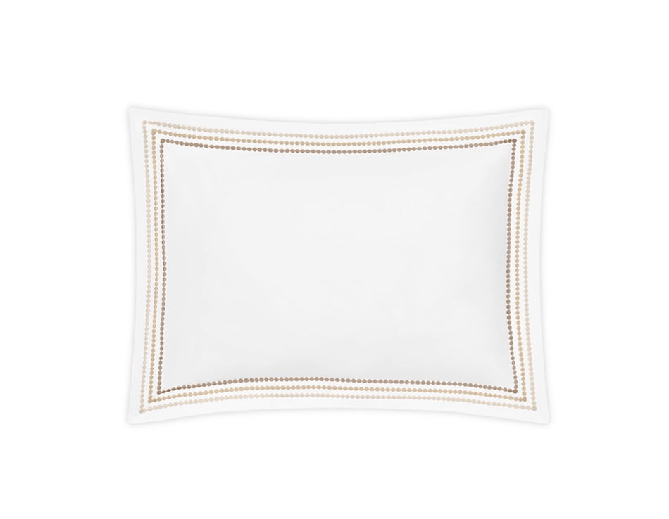 The Amara Triple Pearl rectangular pillow from Matouk features an elegant embroidered design with a double border of gold dots along the edge, displayed on a plain white background.