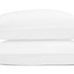 Two white pillows from the Matouk Amara Triple Pearl Bedding Collection are stacked horizontally, each showcasing a triple pearl embroidered motif with three parallel tan stitched lines near one end, set against a plain white background.