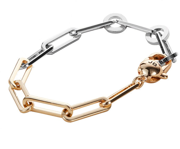 Jenny Bird Andi Slim Bracelet with a silver chain link, gold tone dipped brass accents, and a spherical charm.