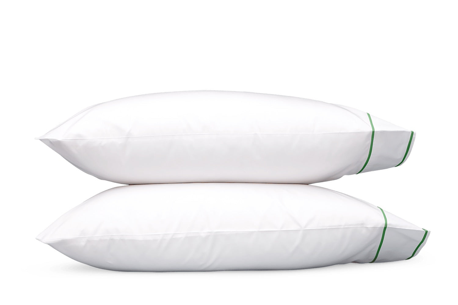Two pillows from the Matouk Ansonia Bedding Collection are stacked on top of each other, each featuring a green stripe with elegant satin stitching near the edge, set against a plain white background.