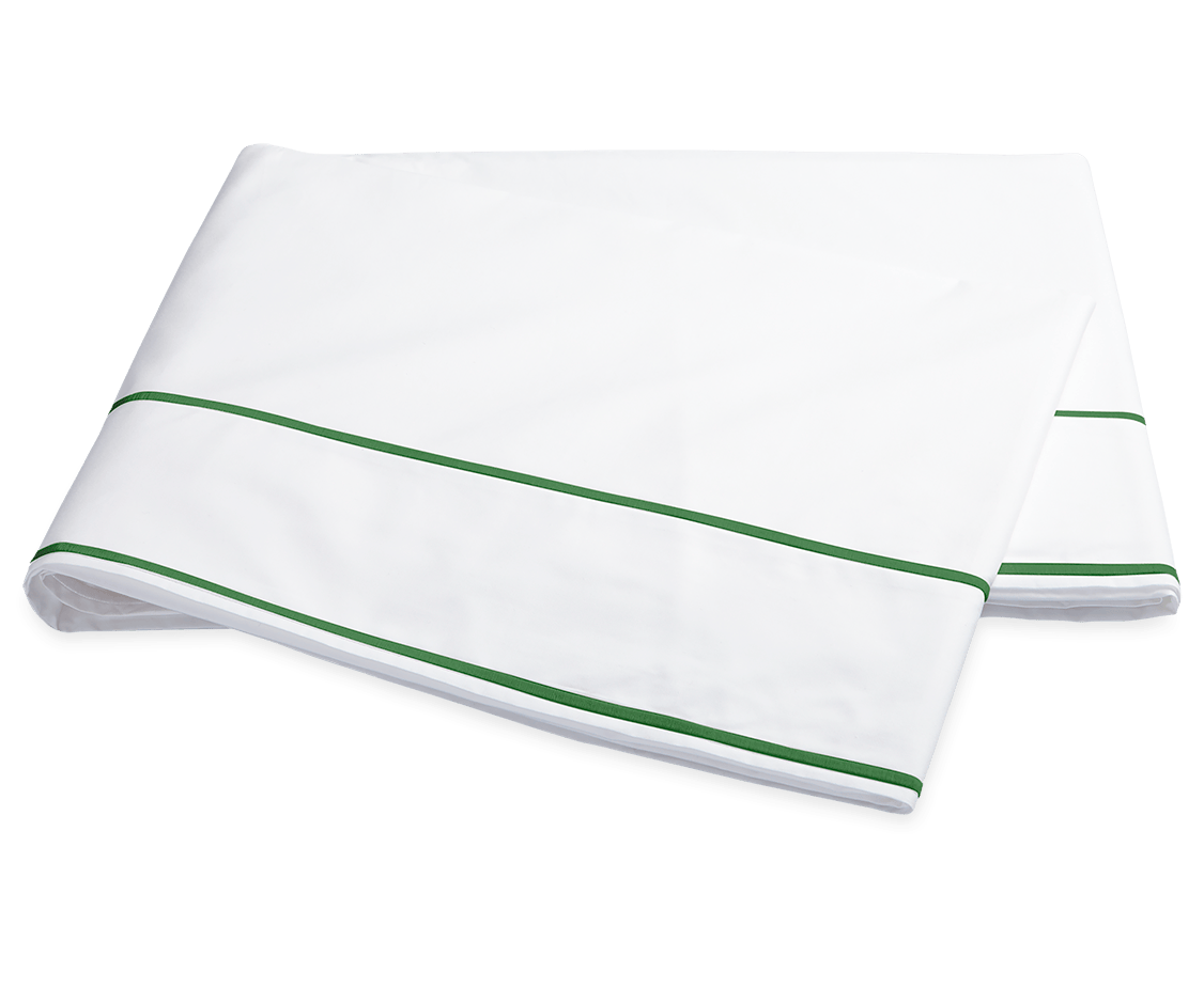 The Ansonia Bedding Collection in Palm by Matouk features a folded white bedsheet with two green stripes near the edge, made from luxurious Egyptian cotton percale, shown on a plain background.