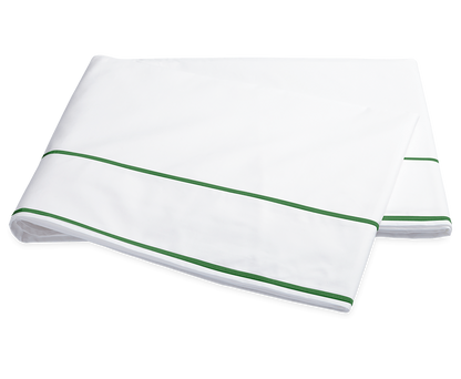 The Ansonia Bedding Collection in Palm by Matouk features a folded white bedsheet with two green stripes near the edge, made from luxurious Egyptian cotton percale, shown on a plain background.
