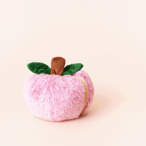A plush toy shaped like a red apple with green felt leaves and a brown stem, set against a plain light background, the Apple Interactive Snuffle Dog Toy by The Foggy Dog features an interactive hidden treat pocket as well as engaging crinkle and squeak elements.