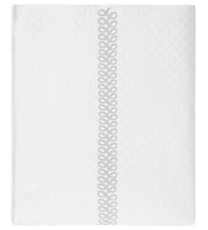 White rectangular pillow with a quilted pattern, featuring Matouk's Astor Braid embroidery and decorative looped edges from the Matouk Astor Braid Matelassé Bedding Collection in Silver.