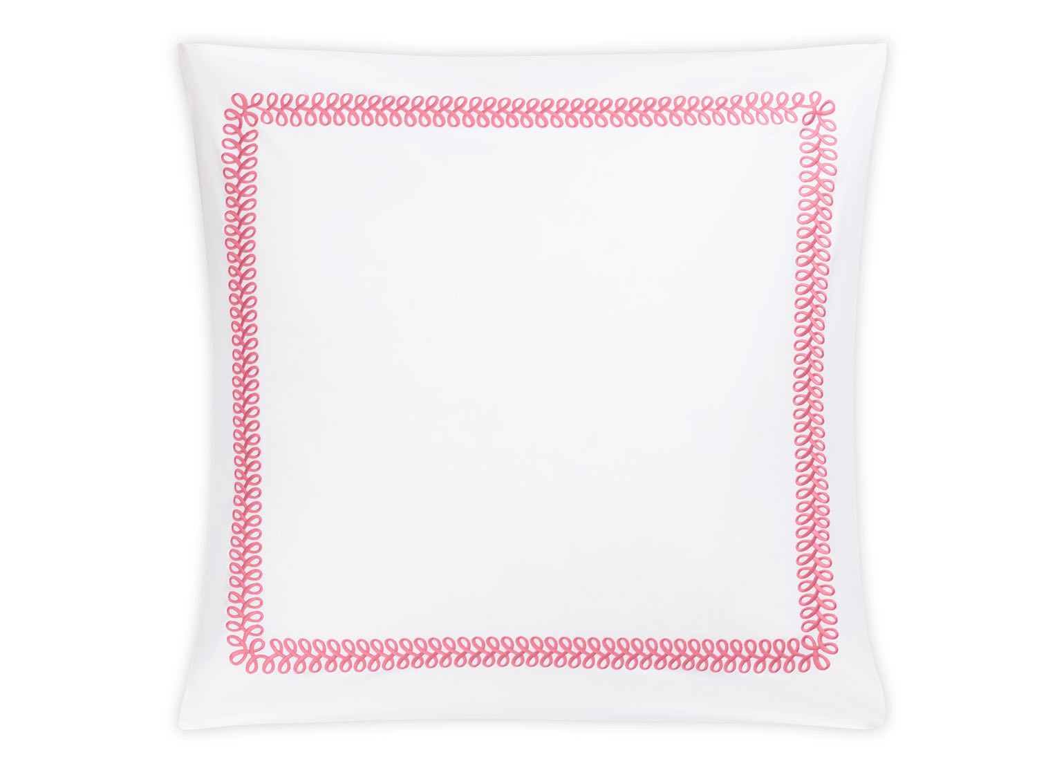 A square white ceramic plate features a pink looping border inspired by Matouk’s Astor Braid Bedding Collection in Peony, echoing the elegant patterns of Schumacher’s Ceylon percale.