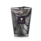 A tall candle from Baobab, labeled as the Atlas Toubkal Candle, features a marble-patterned design and is infused with hints of Atlas cedar and rose.