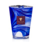 Blue and white marbled glass candle with a brown label featuring "Baobab," offering the subtle elegance of orange blossom, named the Atlas Majorelle Candle from Baobab Collection.