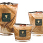 Three Baobab Collection Atlas Tichka candles, featuring a brown marbled design and infused with the earthy aroma of patchouli, displayed on a white background.