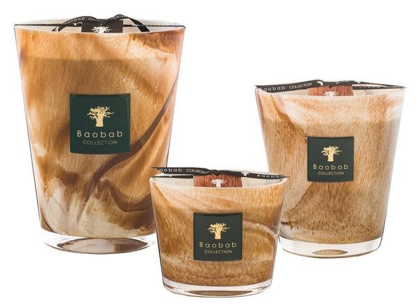 Three Baobab Collection Atlas Tichka candles, featuring a brown marbled design and infused with the earthy aroma of patchouli, displayed on a white background.