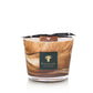 The Baobab Collection Atlas Tichka Candle in a glass holder with a marbled brown design and black ribbon exudes an earthy, rich patchouli aroma.