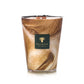 The Baobab Collection Atlas Tichka Candle in a brown and white marbled glass with a black "Baobab" label releases a scent of vetiver and Atlas cedar.