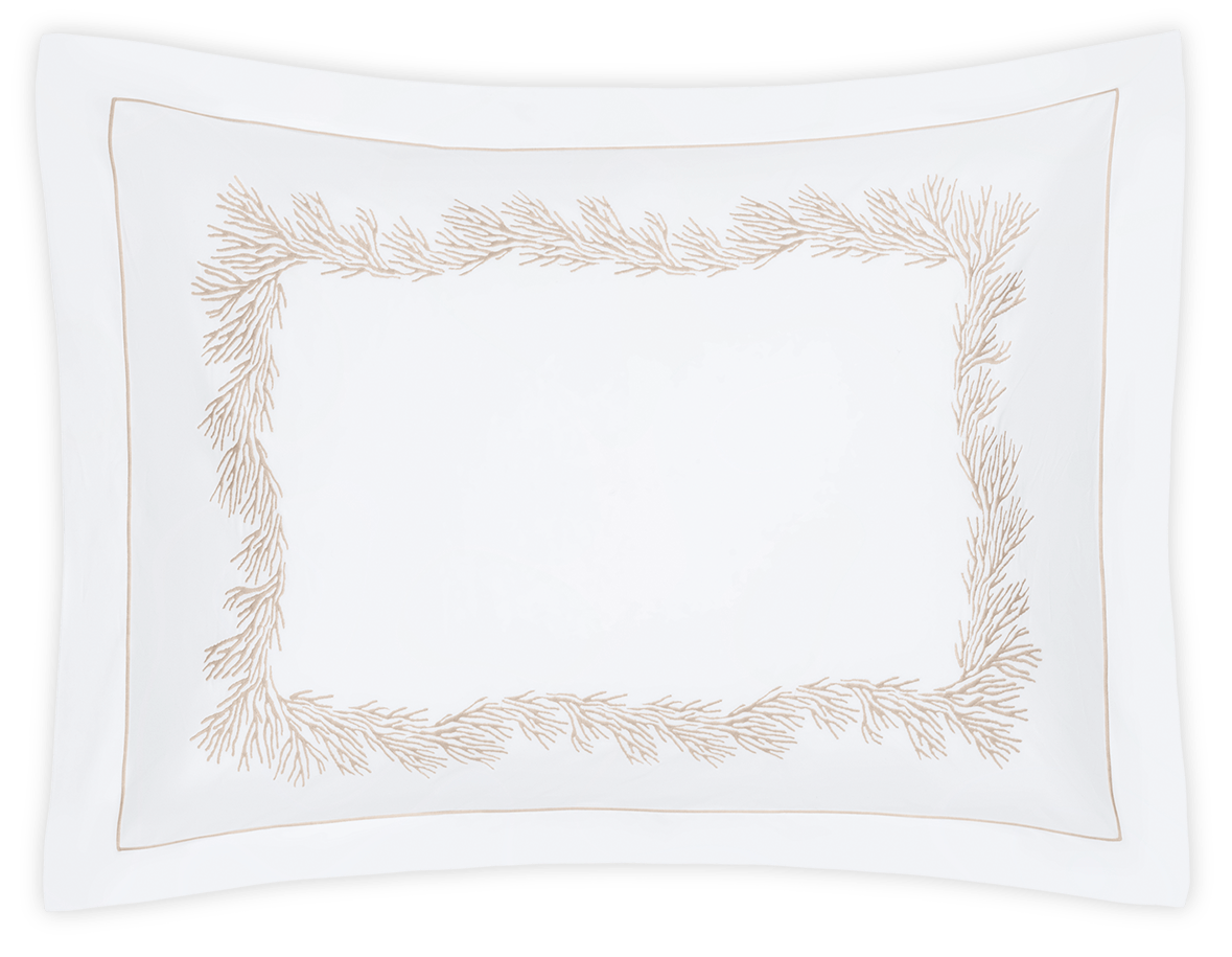 The Atoll Bedding Collection, Dune pillowcase by Matouk is a white rectangular Ceylon cotton percale with a 520 thread count and beige branch embroidery along the center.