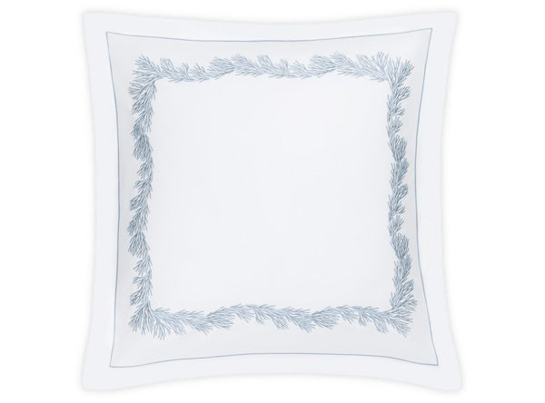 White square pillow from the Atoll Bedding Collection by Matouk, crafted from luxurious 520 thread count CEYLON cotton percale and accented with a subtle blue pine needle wreath embroidery.