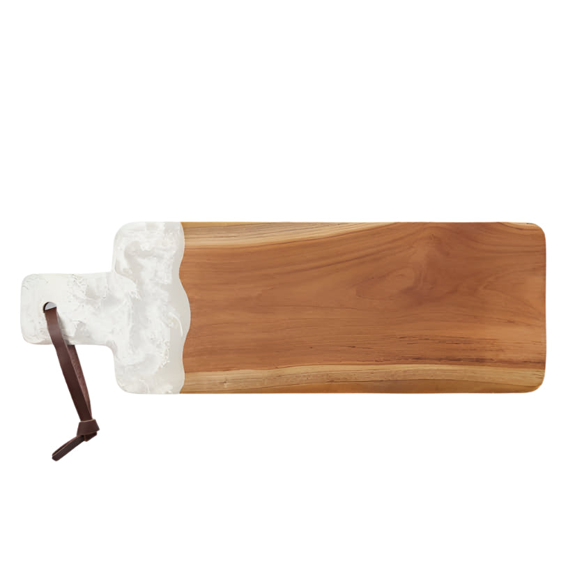 The Austin Swirled Serveware Collection by Blue Pheasant features a handcrafted rectangular teak serving board with a white resin accent and a brown leather hanging loop.
