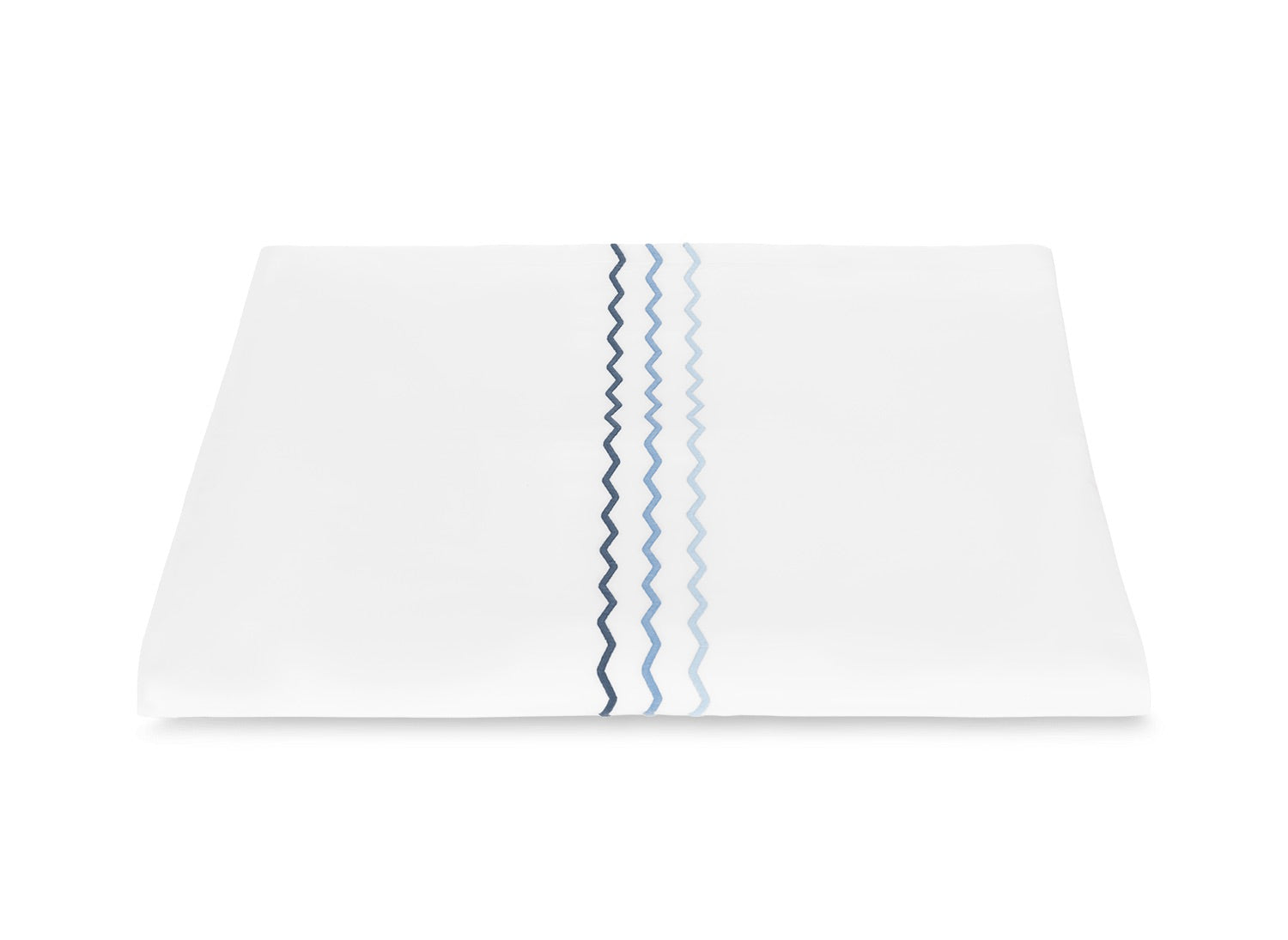 Displayed on a plain white background, the Axel Bedding Collection sheet by Matouk features three vertical wavy lines in blue and navy zigzag embroidery along one edge.
