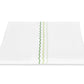 White folded sheet from the Axel Bedding Collection by Matouk, featuring three parallel zigzag lines in varying shades of green embroidered near the center—a sophisticated accent for the modern bed.