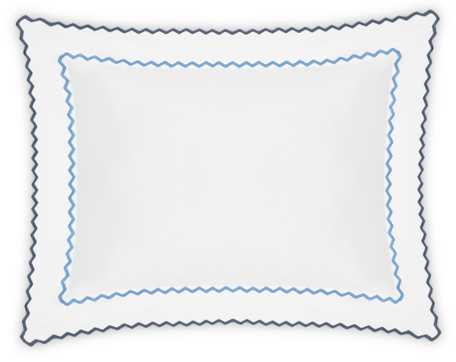 The Axel Boudoir Sham by Matouk is a white rectangular pillow with scalloped edges, blue zigzag embroidery near the edge, and a darker trim. Made from soft long-staple cotton, it adds modern elegance to any room. Shown on a plain background.