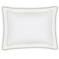 The Axel Bedding Collection by Matouk features a white rectangular pillowcase with scalloped edges and double green zigzag embroidery, crafted from soft long-staple cotton—an elegant touch for a modern bed. Shown on a white background.
