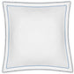 The Axel Bedding Collection by Matouk features a square white pillow made from long-staple cotton, adorned with delicate light blue decorative stitching along the edges, a scalloped border, and subtle zigzag embroidery. Shown against a plain white background, this elegant accent is ideal for adding a refined finishing touch to any modern bed.