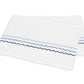 Folded white bedsheet from the Axel Bedding Collection by Matouk, featuring two zigzag embroidered lines—one light blue and one dark blue—near the edge. Crafted from long-staple cotton, this sheet adds a refined touch to any modern bed with its elegant embroidery detailing.