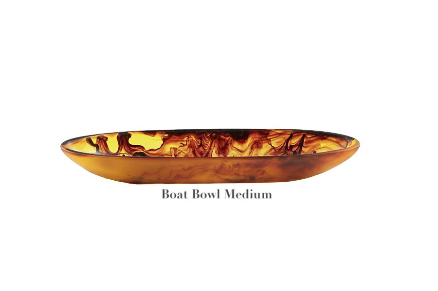 The Tortoise Resin Serveware Collection by Nashi Home features a medium, shallow oval bowl with a marbled amber-brown finish in shatter-resistant resin—ideal for stylish decor. Labeled "Boat Bowl Medium" on the base.