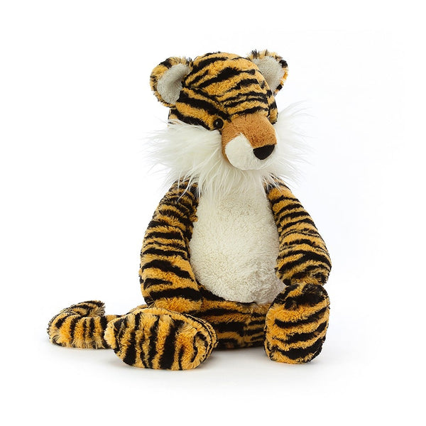 Bashful Tiger plushie sitting on a white background by Jellycat.