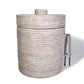 The Matahari White Washed Rattan Ice Bucket Collection features a round, woven design with a Thermos liner, complete with a matching lid and tongs on the side.