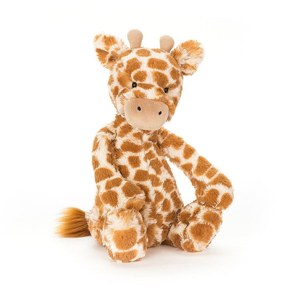 Jellycat Bashful Giraffe plush toy, which is sitting on a white background.