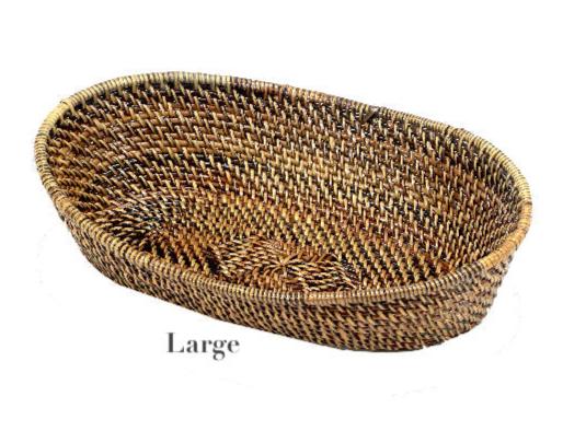 The Calaisio Oval Bread Basket Collection showcases large, oval-shaped eco-crafted baskets made from natural materials by skilled artisans, displayed on a white background.