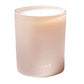 A pale pink frosted glass candle with white wax from L'Avant Collective's Blushed Bergamot Scent Collection, featuring gold "L'AVANT COLLECTIVE" lettering on the front.