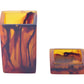 Two translucent amber-colored square containers, one upright and one on its side, are evocative of the vibrant colors at Sydney beaches. These are part of the Nashi Home Bath Collection, Tortoise by Nashi Home.