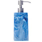 The Nashi Home Denim Resin Bath Collection soap dispenser features a square blue and white marbled design with a silver pump, inspired by Sydney’s aqua waters, shown against a white background.