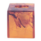 The Nashi Home Bath Collection, Tortoise, features an amber translucent rectangular block with a hollow square cutout on top and swirling patterns reminiscent of the vibrant Sydney beaches.