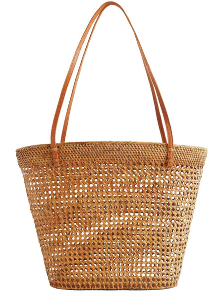 Handwoven Bembien Elena Bag with tan leather handles, isolated on white background.