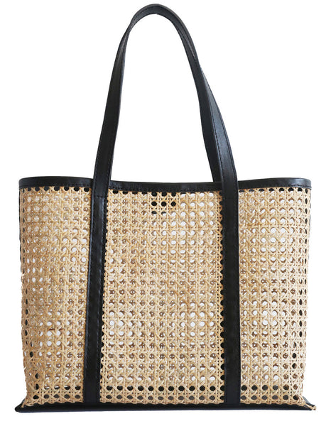 A Bembien Margot bag featuring a woven rattan center with black leather trims and handles, isolated on a white background.