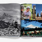 An open book from Assouline titled "Big Sky" displays photos of people hiking, horseback riding, and reading trail signs amid the stunning mountainous landscapes of Montana.