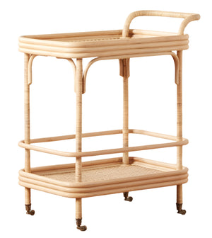 The Flore Bistro Bar Cart by Selamat features a two-tiered Manau rattan design with a handle, caster wheels, woven lower shelf, and an open frame inspired by French café style.
