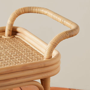 Close-up of the Selamat Flore Bistro Bar Cart, highlighting its woven details and curved design that evoke a French café ambiance against a neutral background.