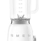 A Smeg blender from the SMEG Blender Collection features stainless steel dual blades, a transparent Tritan BPA-free jug with measurement markings, and a silver dial on its base.