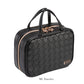 The Stephanie Johnson Belize Raven Travel Collection features a black woven leather bag with two top handles, dual zippers, removable compartments, and a metal label on the front. "ML Traveler" appears below the bag.
