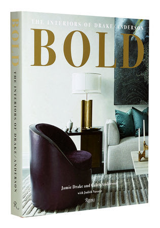A Rizzoli book titled "BOLD : The Interiors of Drake/Anderson" with a front cover featuring a contemporary design chair, lamp, and a well-designed interior space.